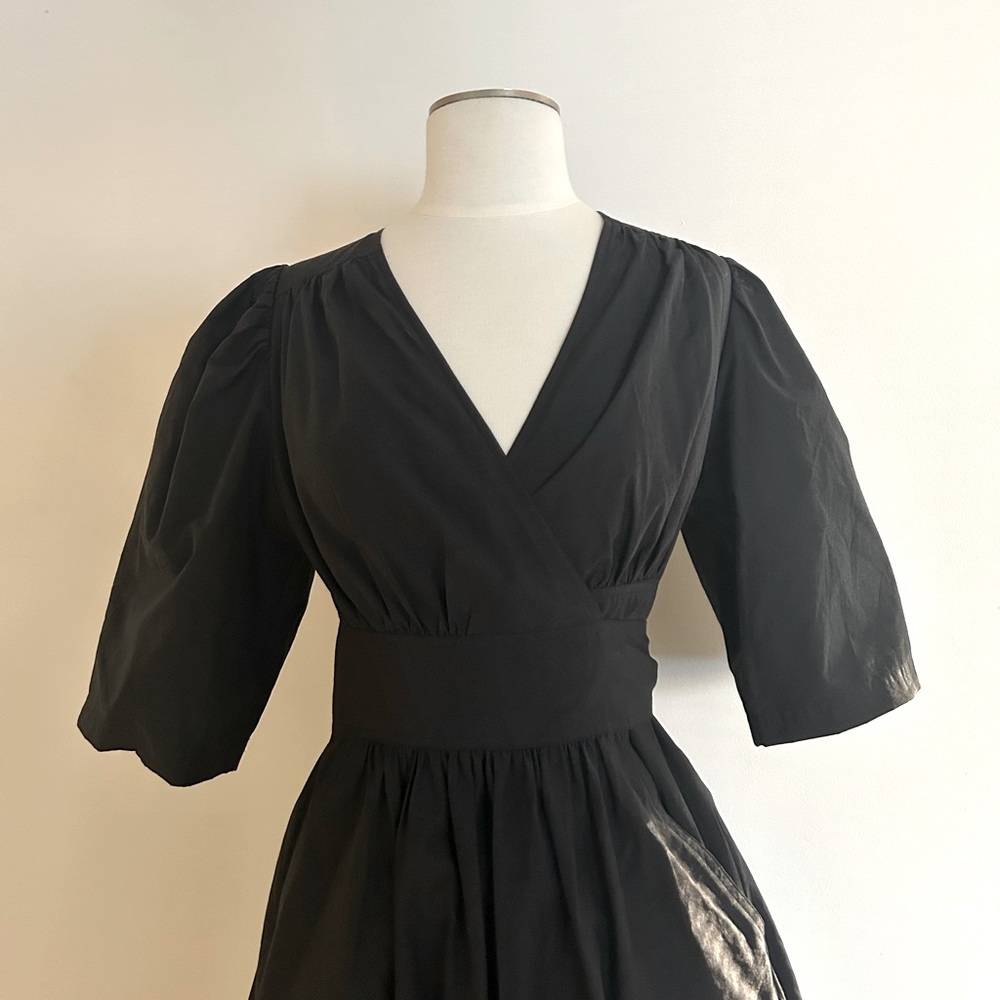 & other stories wrap midi dress with fitted bodice and voluminous skirt.